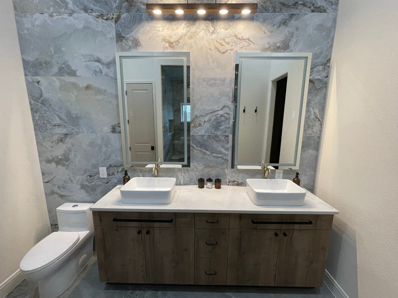 Bathroom renovation with tile shower and vanity